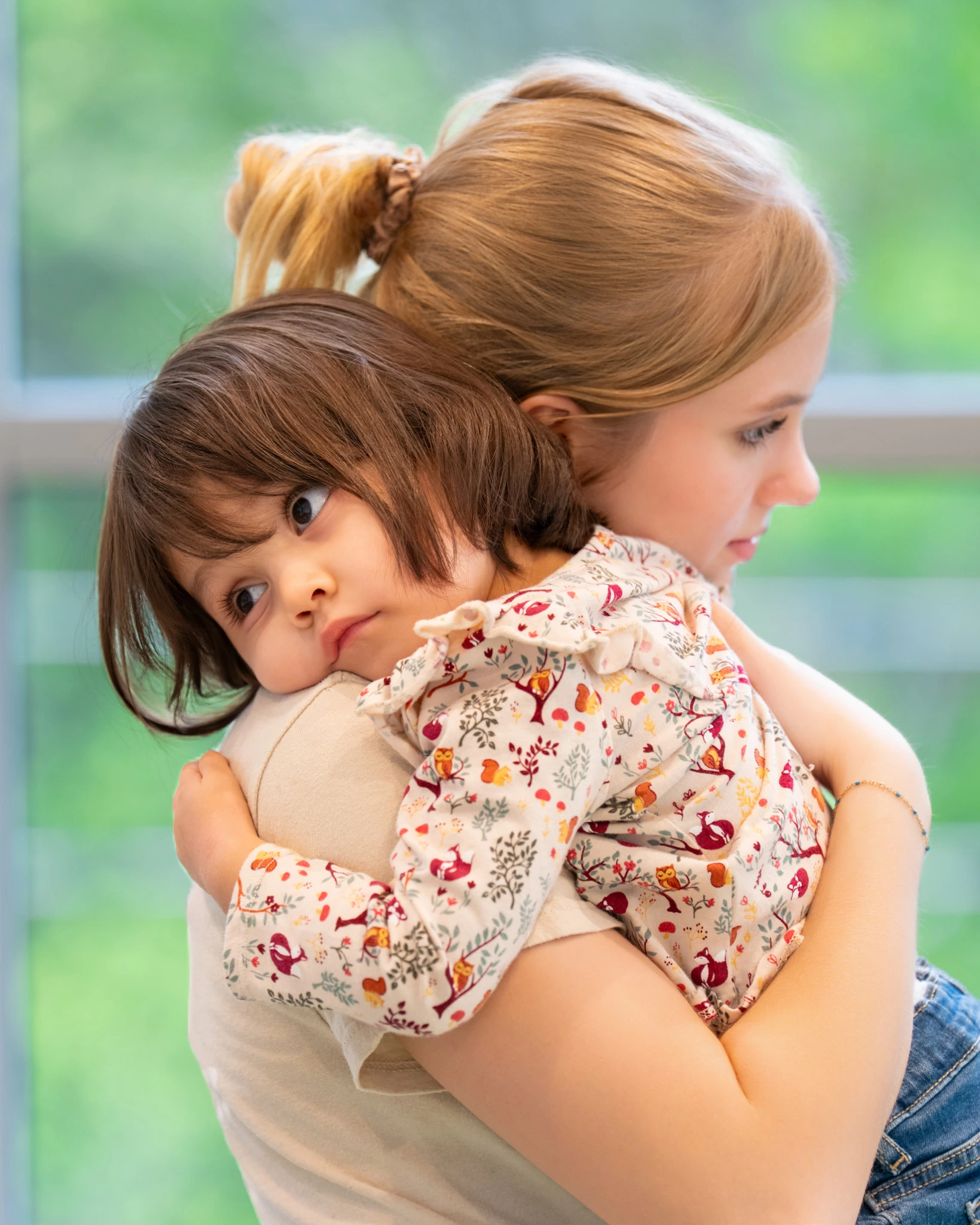Child held against the shoulder of a person in the children's room at Ascend Church.